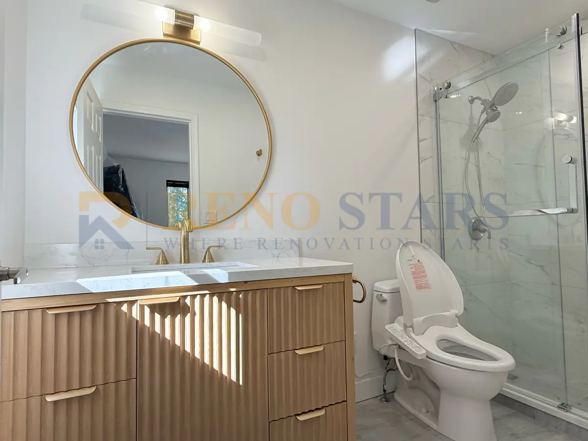 Curbless walk-in shower with white tile and brushed nickel fixtures in a Coquitlam bathroom