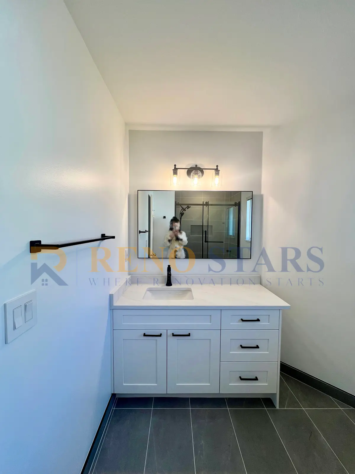 Richmond bathroom renovation with gray large-format tile, new tub-shower combo, and polished chrome faucet