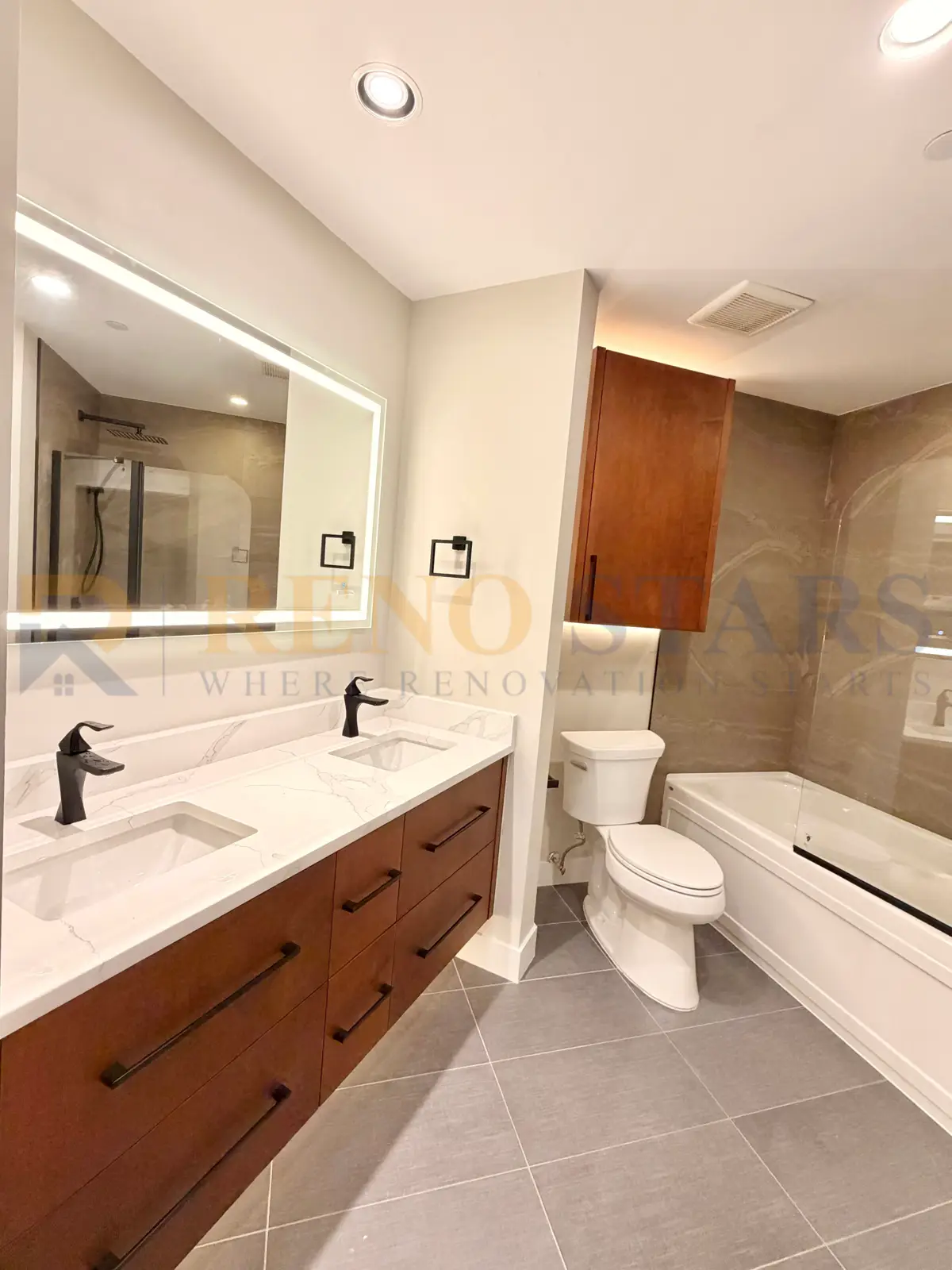 Master bathroom renovation with double vanity and heated tile floors in Vancouver