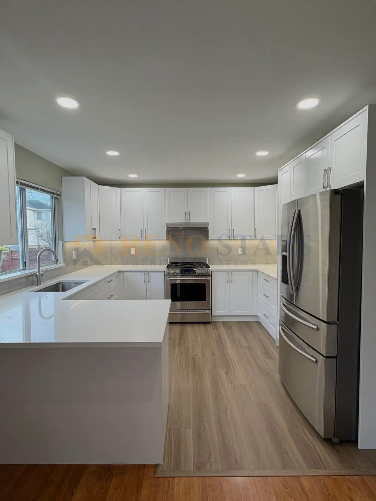 White shaker kitchen renovation in Richmond with quartz countertops and undermount sink