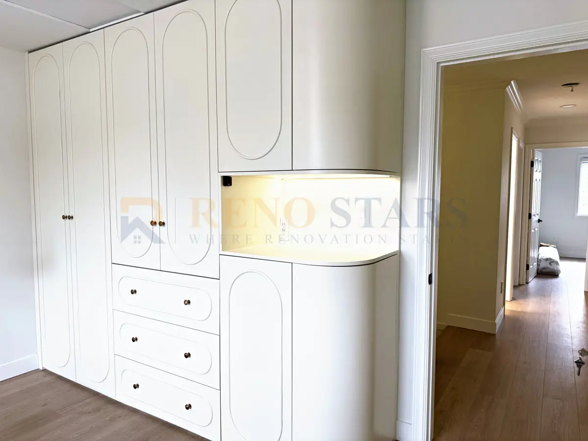 Powder room renovation in Richmond: vessel basin, organic-shaped mirror, gold fixtures