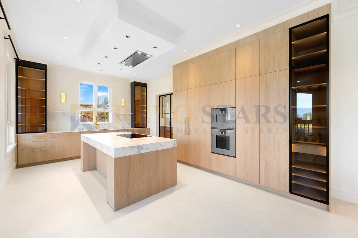 Custom kitchen renovation with gold fixtures in Burnaby by Reno Stars