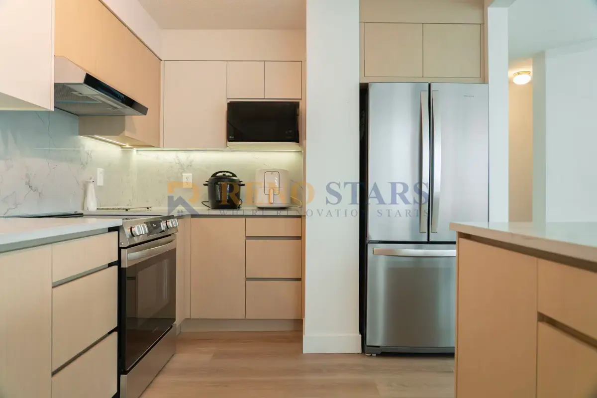 Modern kitchen renovation in Surrey with custom cabinets and integrated appliances