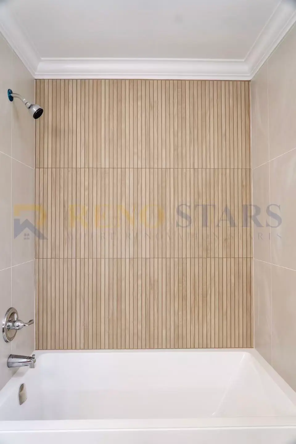 Two custom-tiled bathrooms with quartz countertops and brushed nickel fixtures in a Burnaby home