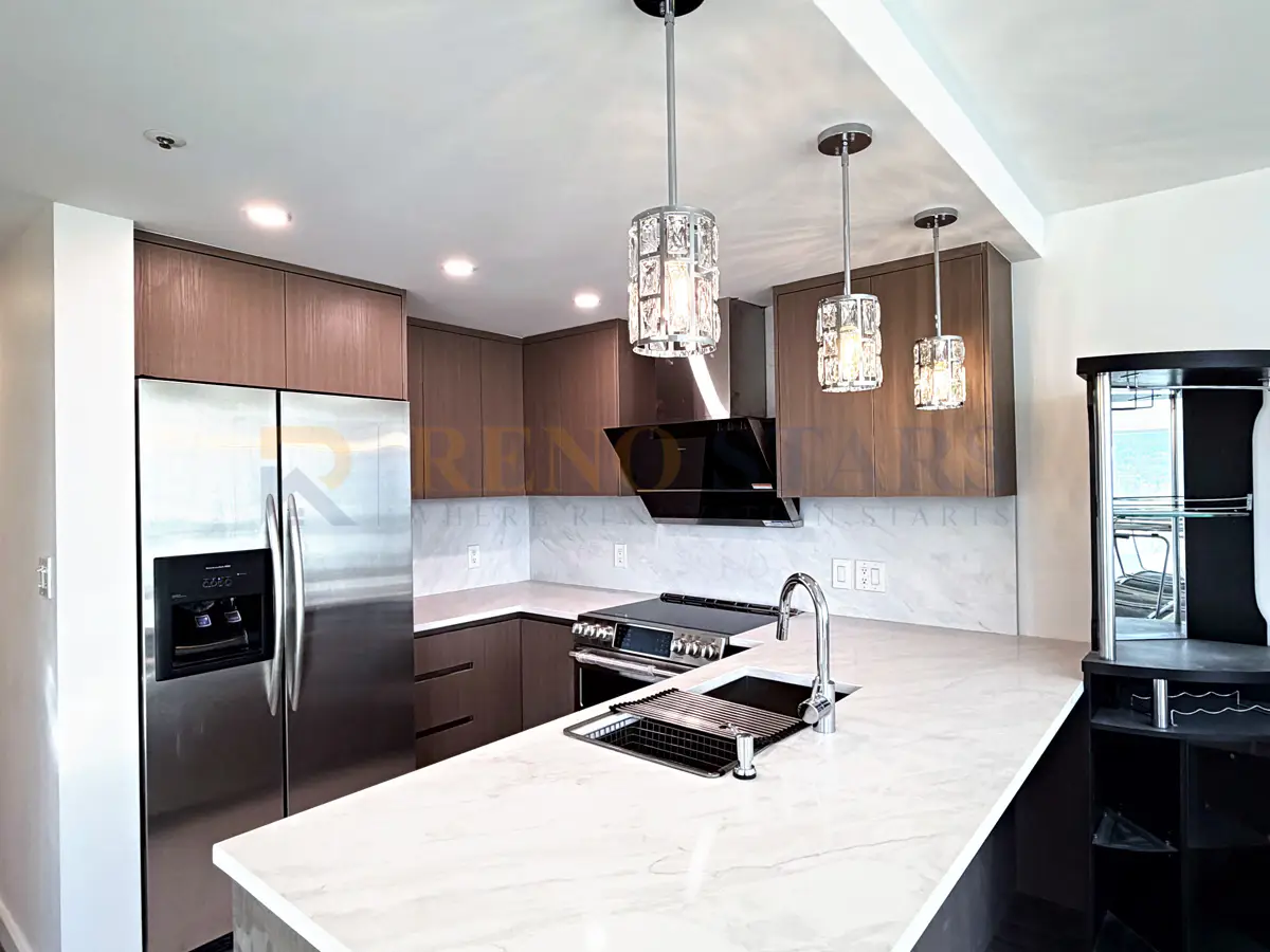 Modern kitchen with custom plywood cabinets, Luminous quartz countertops, full-height quartz backsplash and LED under-cabinet lighting in a Coal Harbour Vancouver condo